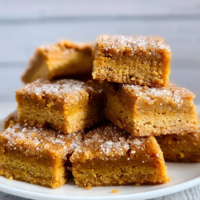 Deliciously topped Sugar Cookie Vegan Pumpkin Bars garnished with pumpkin seeds