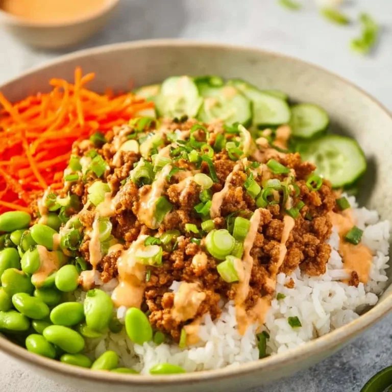 Ground turkey rice bowls topped with Bang Bang sauce for a flavorful meal.