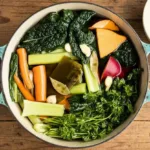 A bowl of healing mineral broth made with fresh vegetables and herbs.