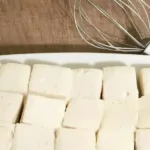 Homemade naturally-sweetened marshmallows on a wooden table