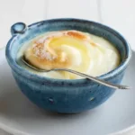 Bowl of Rømmegrøt, a traditional Norwegian sour cream porridge topped with cinnamon and sugar